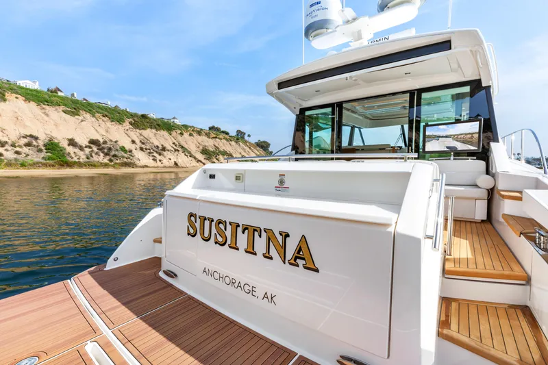 Slide: The Image of 2022 Tiara Yachts 53 Coupe docked near scenic cliffs. - 19