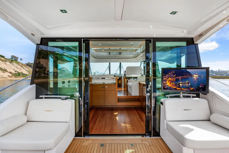 Slide: The Image of Luxurious 2022 Tiara Yachts 53 Coupe interior with elegant seating and scenic views. - 25