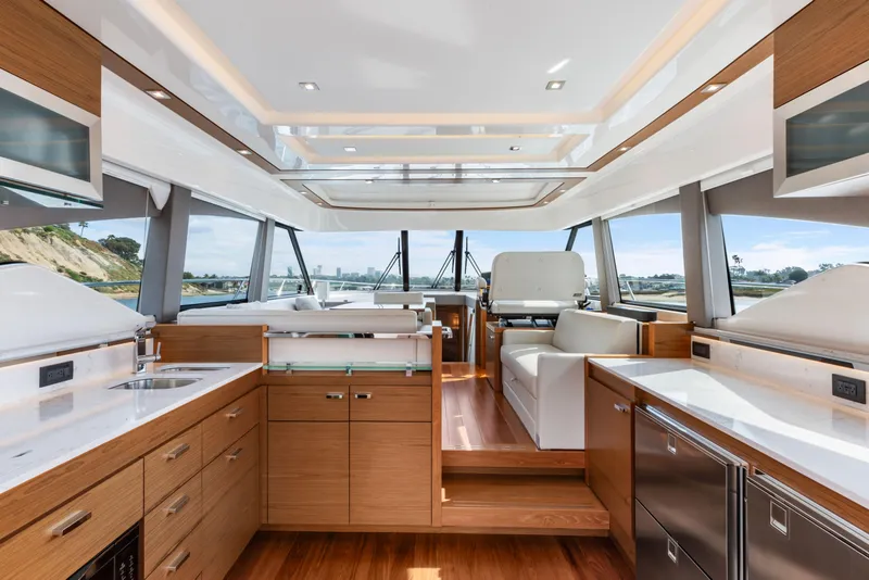 Slide: The Image of Luxurious interior of 2022 Tiara Yachts 53 Coupe with modern design and panoramic windows. - 26