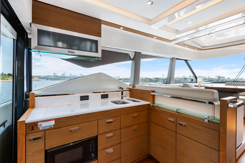 Slide: The Image of Luxurious interior of 2022 Tiara Yachts 53 Coupe with modern kitchen and scenic views. - 30