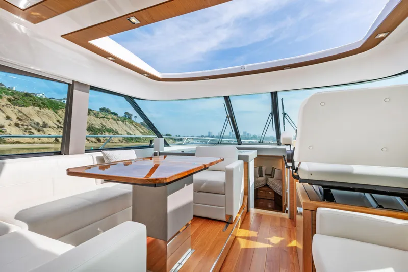 Slide: The Image of Luxurious interior of 2022 Tiara Yachts 53 Coupe with panoramic windows and elegant seating. - 31