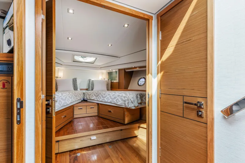 Slide: The Image of Luxurious interior of 2022 Tiara Yachts 53 Coupe with elegant wood finishes and modern design. - 39