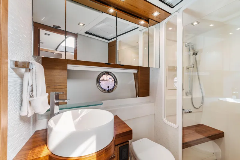 Slide: The Image of Luxurious bathroom in 2022 Tiara Yachts 53 Coupe, featuring modern fixtures and elegant design. - 40