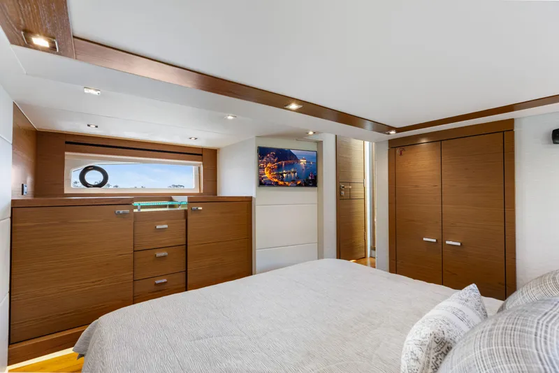 Slide: The Image of Luxurious bedroom interior of 2022 Tiara Yachts 53 Coupe with modern wood finishes. - 45