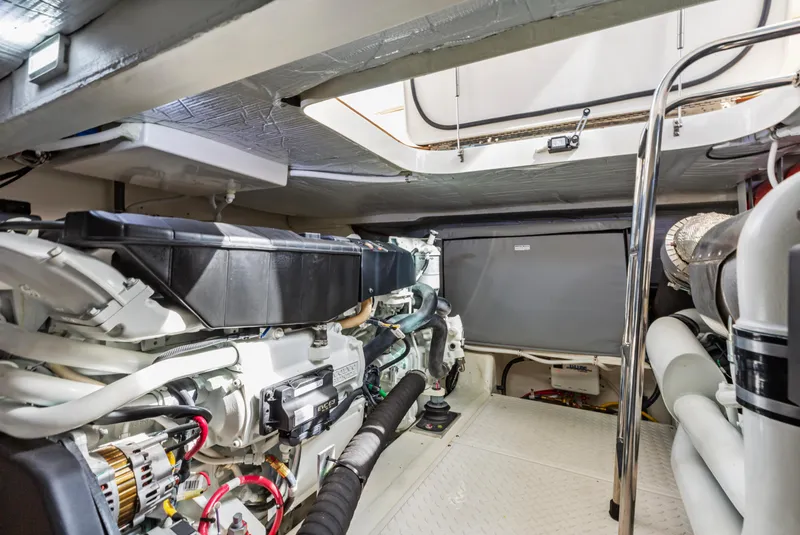 Slide: The Image of Engine room of 2022 Tiara Yachts 53 Coupe, showcasing advanced marine machinery. - 47