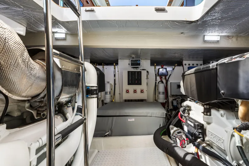 Slide: The Image of Engine room of 2022 Tiara Yachts 53 Coupe, showcasing advanced machinery and equipment. - 48