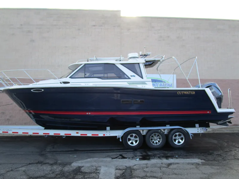 Slide: The Image of 2024 Cutwater C-288 C boat on trailer with Yamaha engine. - 1
