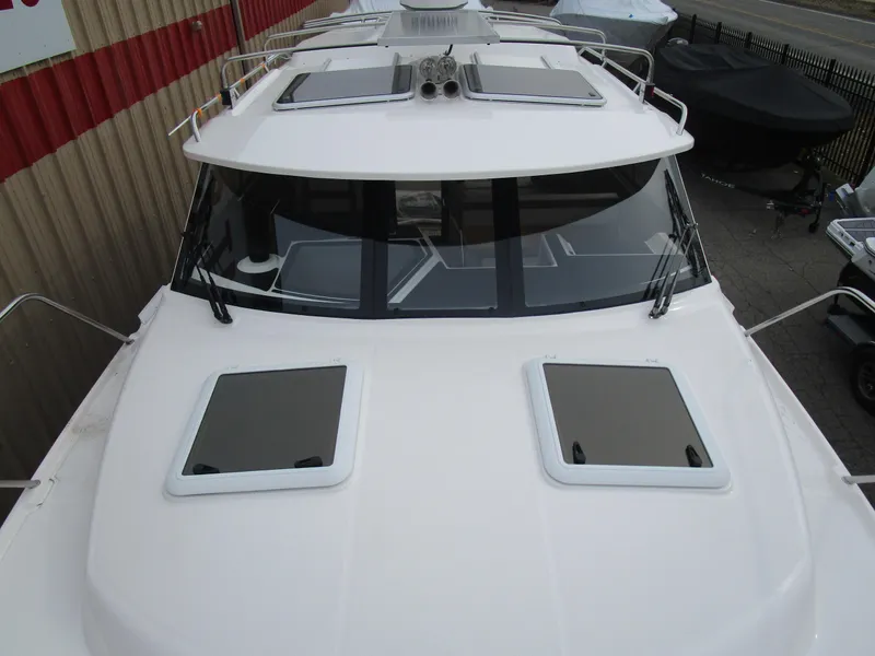 Slide: The Image of 2024 Cutwater C-288 C boat stern with ladder and trim tab. - 11