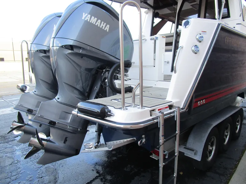 Slide: The Image of 2024 Cutwater C-288 C boat interior with seating, grill, and modern flooring. - 16