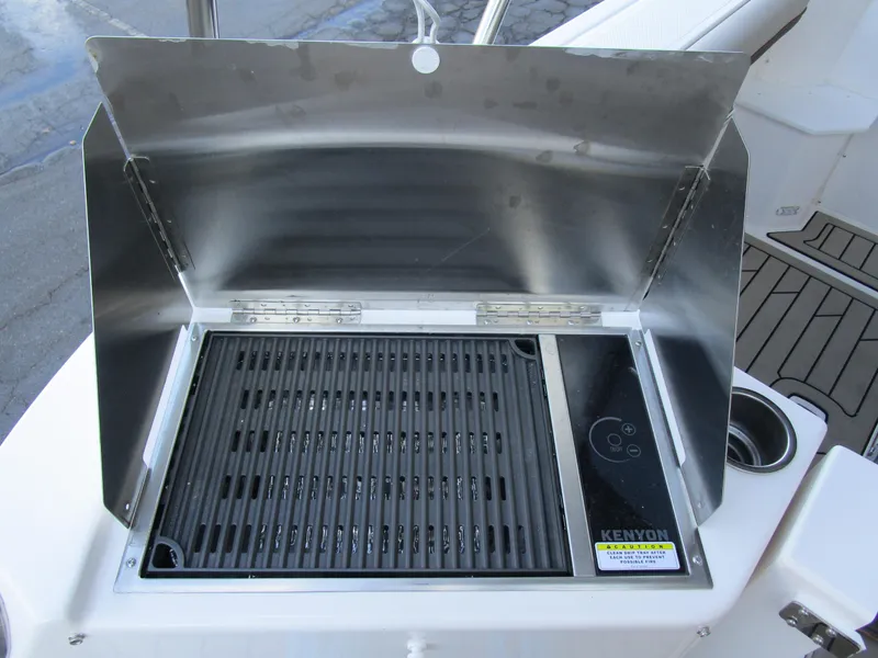 Slide: The Image of 2024 Cutwater C-288 C interior with modern helm, seating, and navigation equipment. - 22