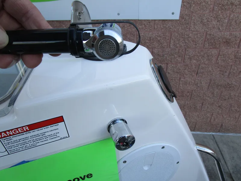 Slide: The Image of 2024 Cutwater C-288 C interior helm with modern seat and kitchen amenities. - 25