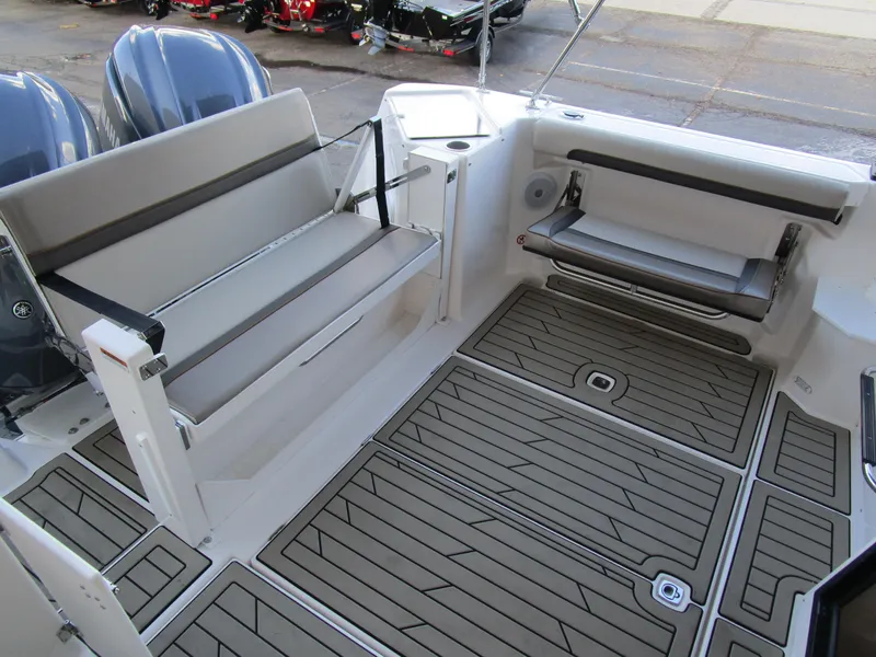 Slide: The Image of 2024 Cutwater C-288 C helm with dual Garmin displays and wooden steering wheel. - 27