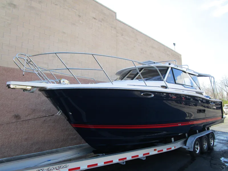 Slide: The Image of 2024 Cutwater C-288 C boat anchor system on deck, featuring stainless steel fittings. - 7