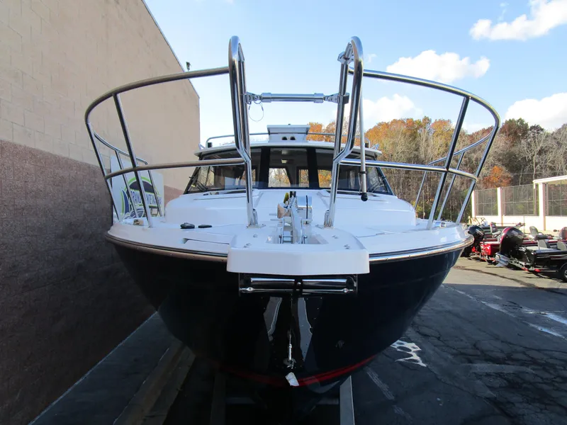 Slide: The Image of 2024 Cutwater C-288 C boat with dual hatches and Garmin equipment. - 8