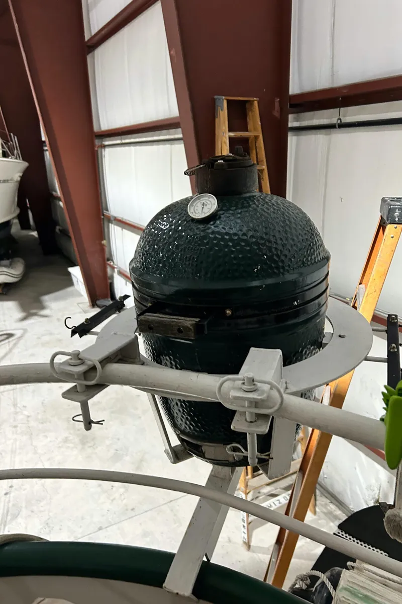 Slide: The Image of Green ceramic grill on a 1993 Custom Steel Trawler in a boatyard. - 29