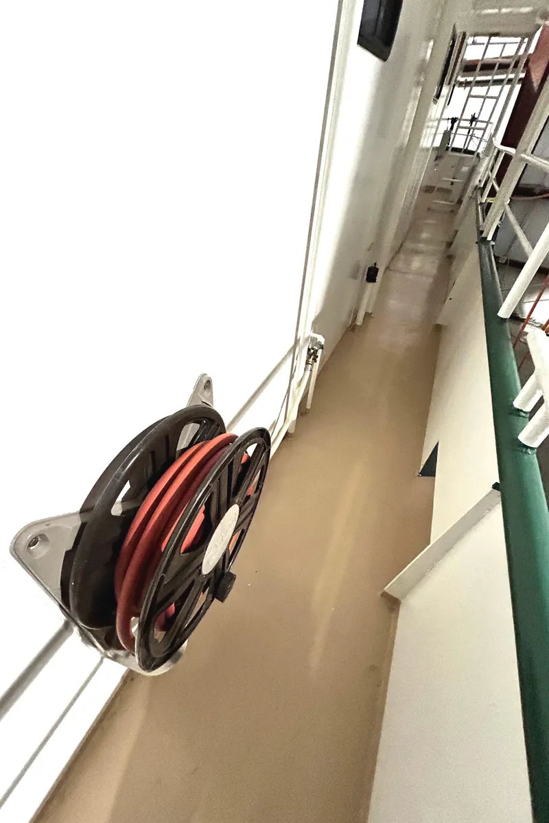 Slide: The Image of 1993 Custom Steel Trawler deck with hose reel and safety railings - 30