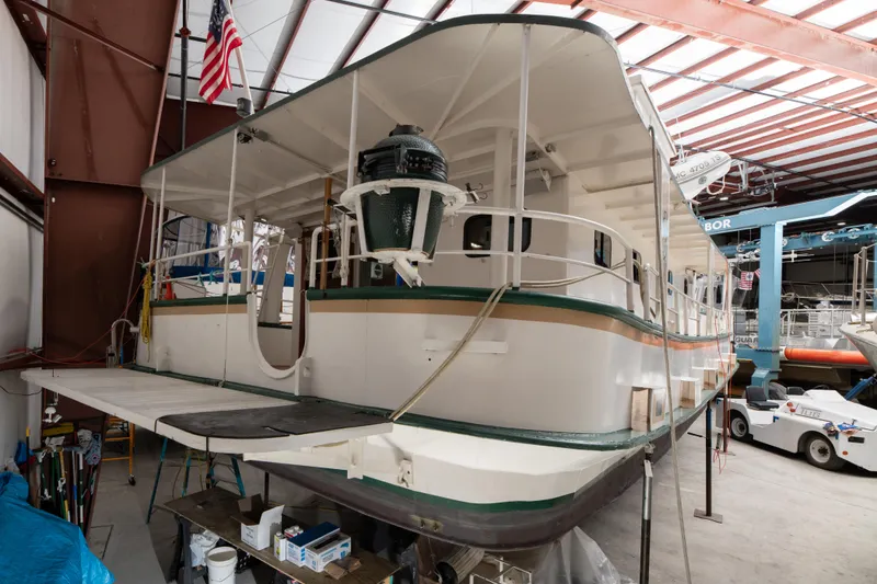 Slide: The Image of 1993 Custom Steel Trawler in a boatyard for maintenance. - 31