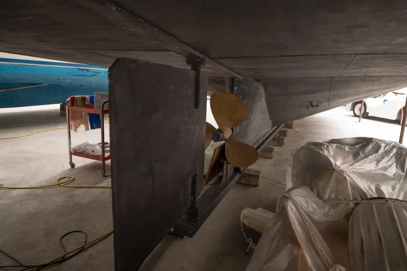 Slide: The Image of Underwater view of a 1993 Custom Steel Trawler's propeller and rudder in dry dock. - 33
