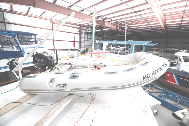 Slide: The Image of Inflatable boat on a 1993 Custom Steel Trawler in a marina warehouse. - 34