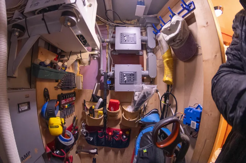 Slide: The Image of 1993 Custom Steel Trawler engine room with tools and equipment. - 38