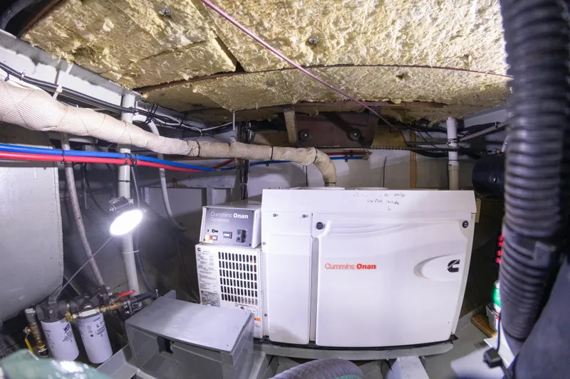 Slide: The Image of Engine room of a 1993 Custom Steel Trawler with Cummins Onan generator. - 43