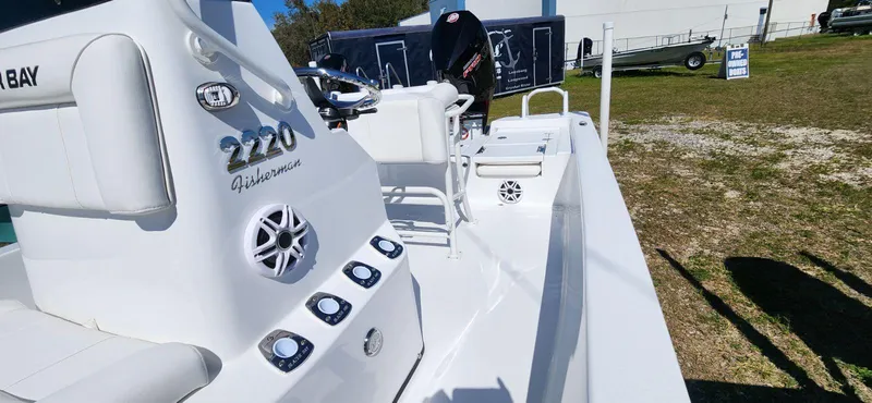 Slide: The Image of 2024 Blazer 2220 Fisherman boat, white interior, outdoor display. - 2
