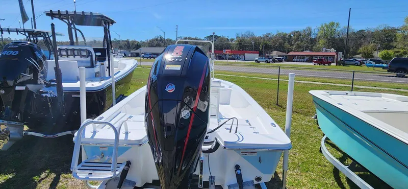 Slide: The Image of 2024 Blazer 2220 Fisherman boat with powerful outboard motor, displayed outdoors. - 5