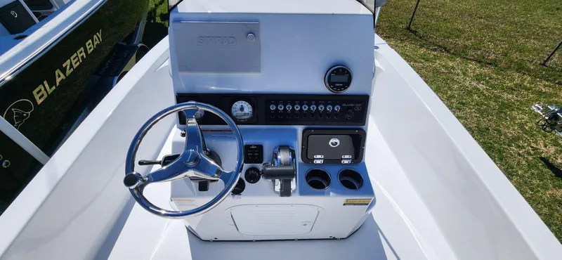 Slide: The Image of 2024 Blazer 2220 Fisherman boat console with steering wheel and controls. - 6