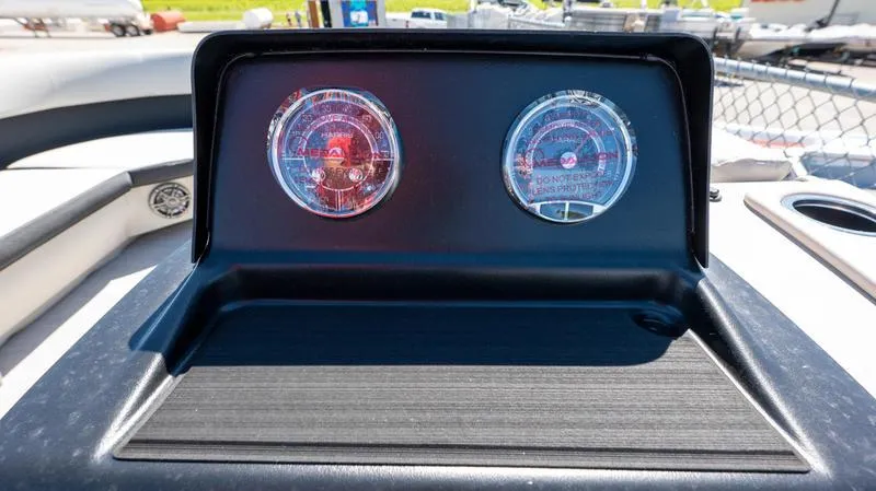 Slide: The Image of Dashboard of 2024 Harris 230 Breeze boat with dual gauges. - 13