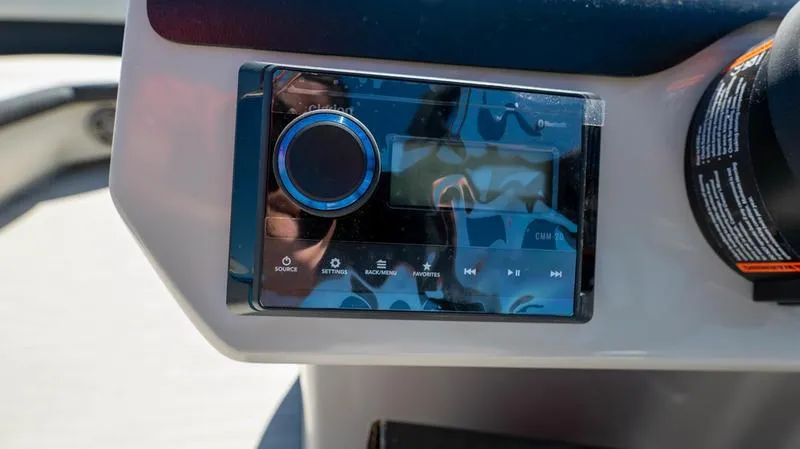Slide: The Image of Close-up of the 2024 Harris 230 Breeze boat's control panel. - 14