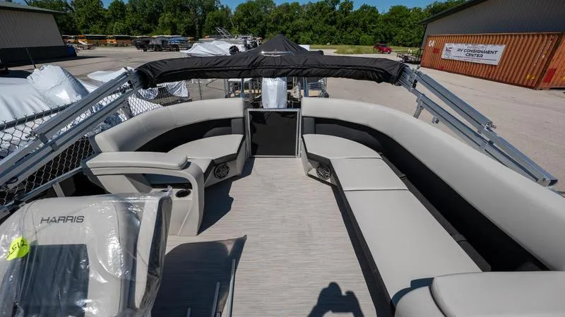 Slide: The Image of 2024 Harris 230 Breeze pontoon boat with spacious seating and modern design. - 16