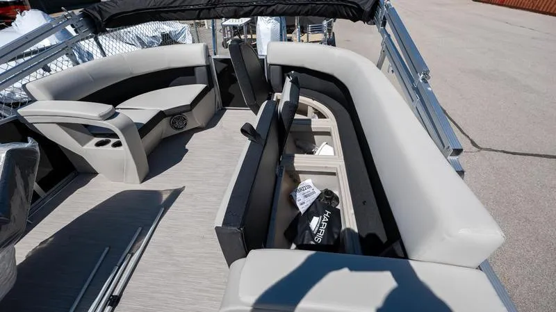 Slide: The Image of 2024 Harris 230 Breeze pontoon boat with spacious seating and modern design. - 17