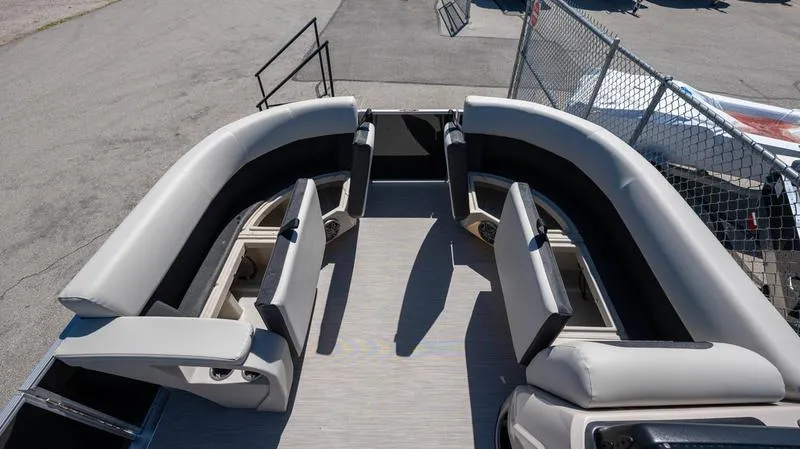 Slide: The Image of 2024 Harris 230 Breeze pontoon boat with spacious seating and modern design. - 19