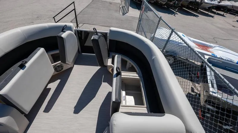 Slide: The Image of 2024 Harris 230 Breeze boat interior with spacious seating and storage compartments. - 22
