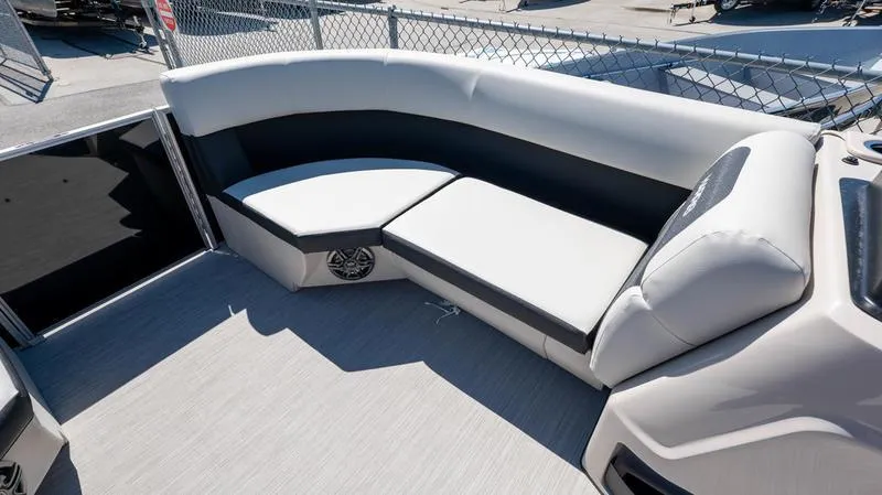 Slide: The Image of 2024 Harris 230 Breeze boat interior with cushioned seating and modern design. - 23