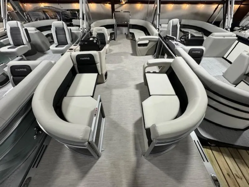 Slide: The Image of 2024 Harris 230 Breeze pontoon boat interior with luxurious seating and modern design. - 3