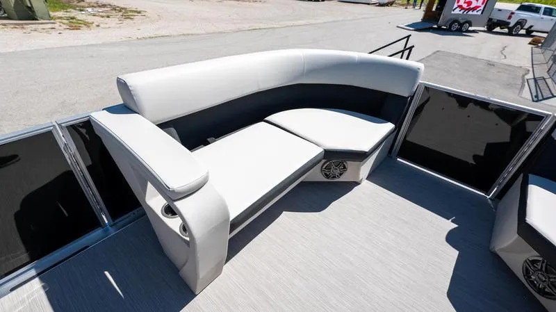 Slide: The Image of 2024 Harris 230 Breeze boat interior with white cushioned seating. - 5
