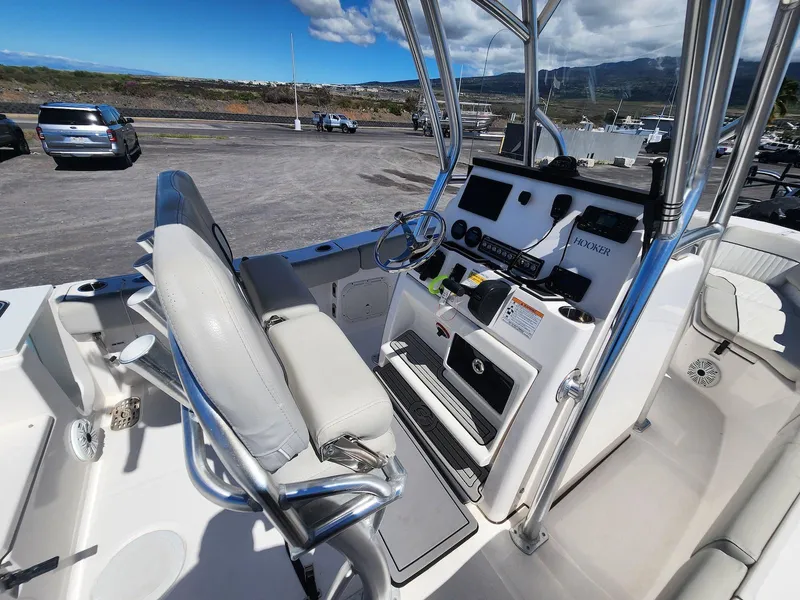 Slide: The Image of 2021 Sea Fox 228 Commander boat interior with steering console and seating. - 11