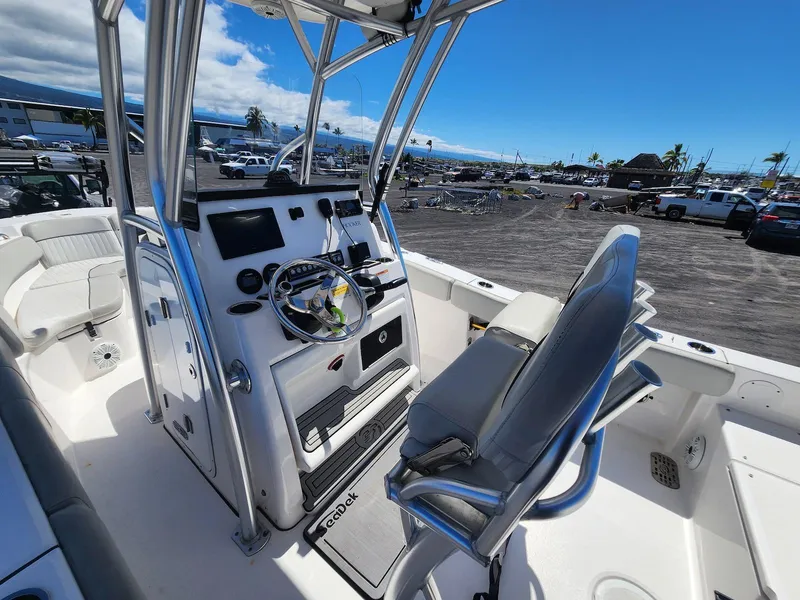 Slide: The Image of 2021 Sea Fox 228 Commander boat interior with steering console and seating. - 12