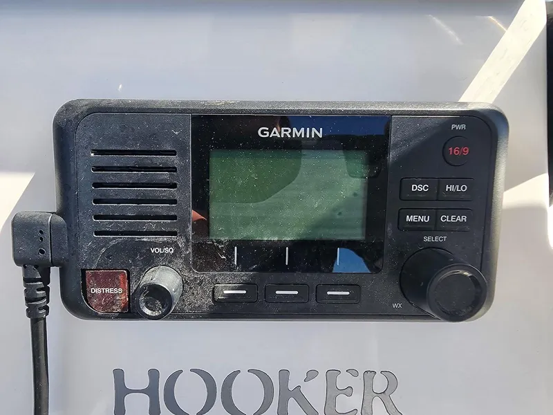 Slide: The Image of Garmin marine radio on 2021 Sea Fox 228 Commander boat dashboard. - 14