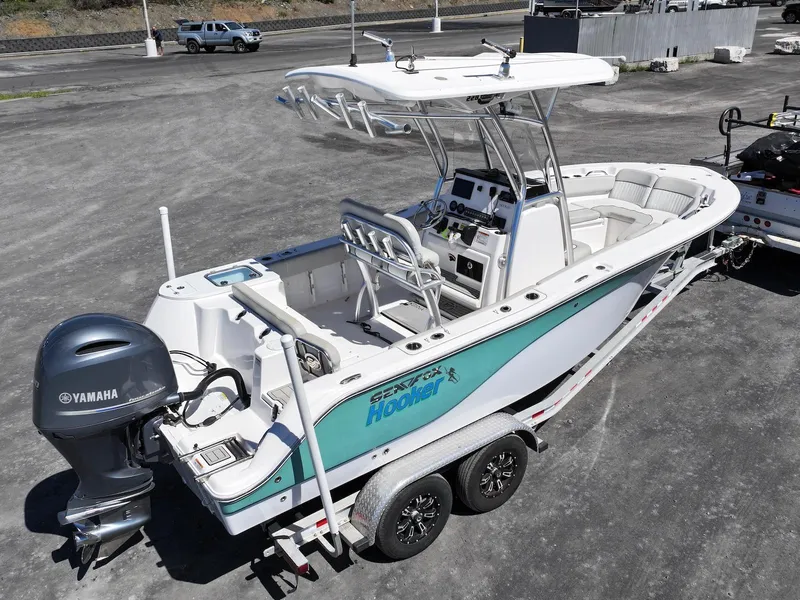 Slide: The Image of 2021 Sea Fox 228 Commander boat on trailer with Yamaha outboard motor, parked on asphalt. - 5