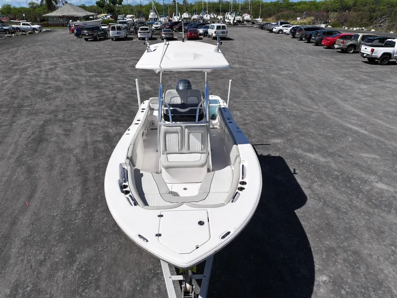 Slide: The Image of 2021 Sea Fox 228 Commander boat in a parking lot, viewed from the front. - 9