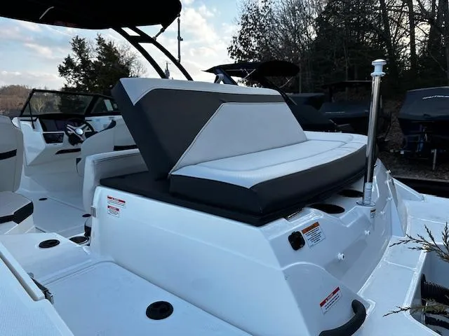 Slide: The Image of 2024 Sea Ray SPX 210 Outboard boat interior with sleek seating design. - 11