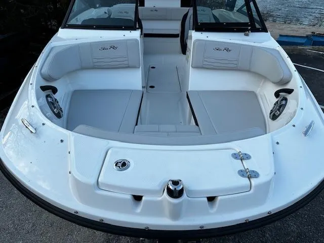 Slide: The Image of 2024 Sea Ray SPX 210 Outboard boat with spacious seating and sleek design. - 12