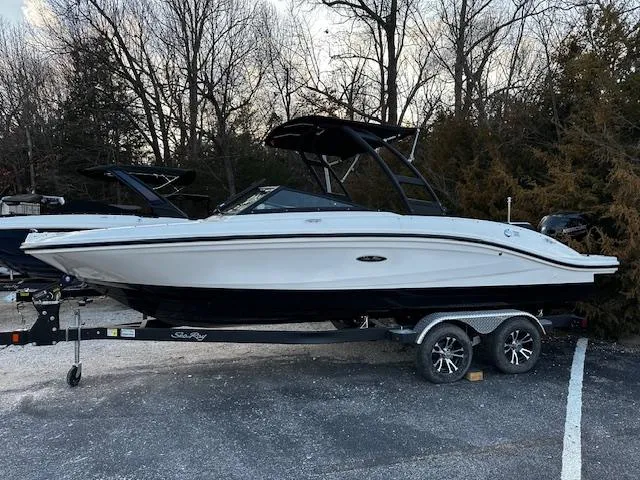 Slide: The Image of 2024 Sea Ray SPX 210 Outboard boat on trailer, parked outdoors. - 14