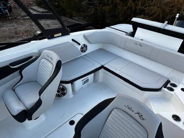 Slide: The Image of 2024 Sea Ray SPX 210 Outboard interior with sleek seating and modern design. - 4