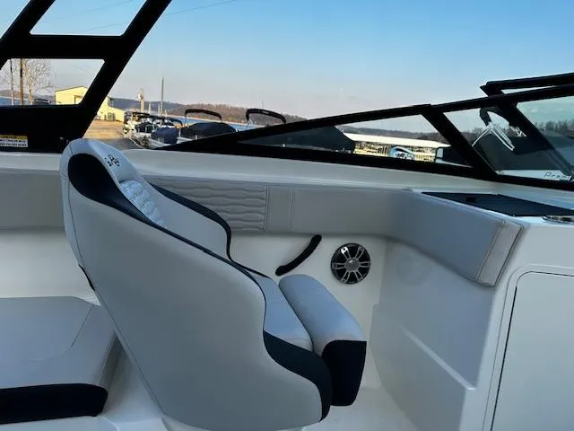 Slide: The Image of 2024 Sea Ray SPX 210 Outboard interior with sleek seating and modern design. - 6