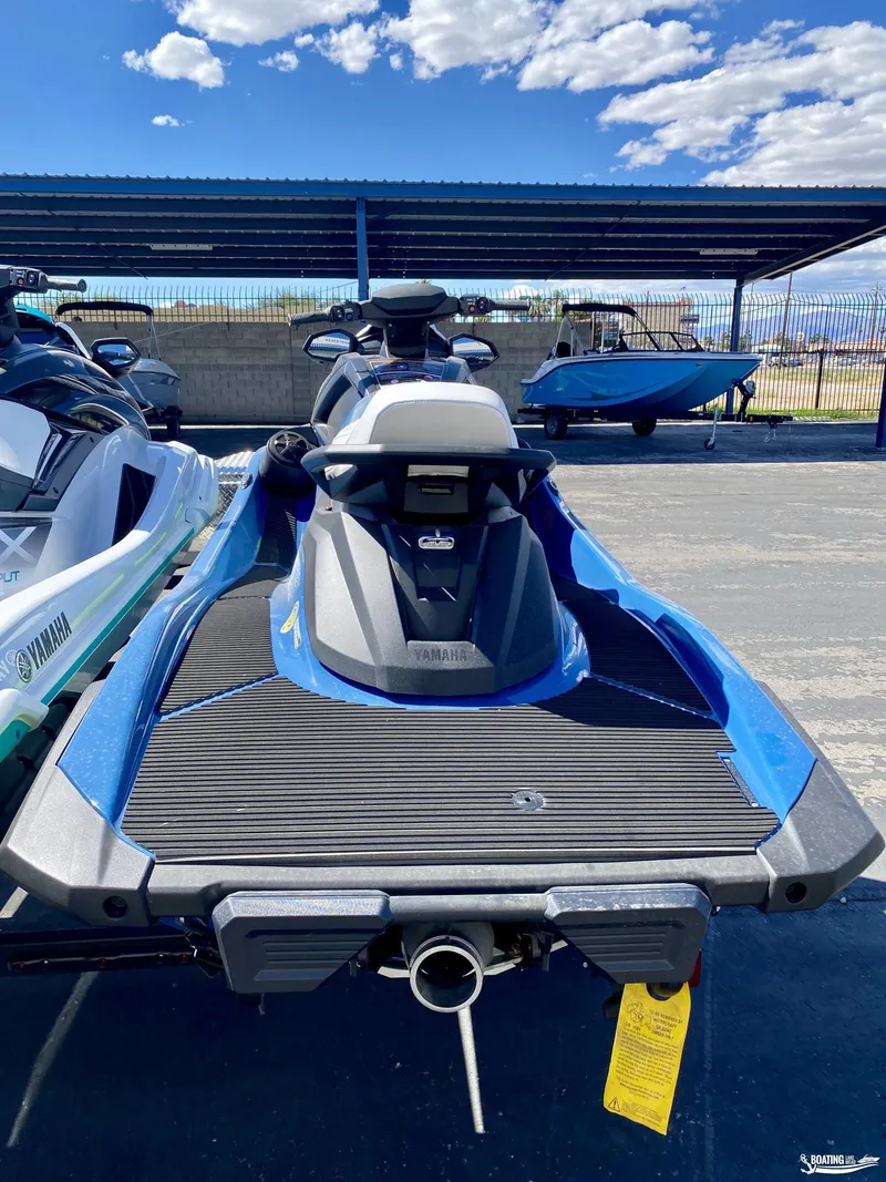 Slide: The Image of 2024 Yamaha WaveRunner VX Cruiser with Audio, blue, rear view, parked under a canopy. - 3
