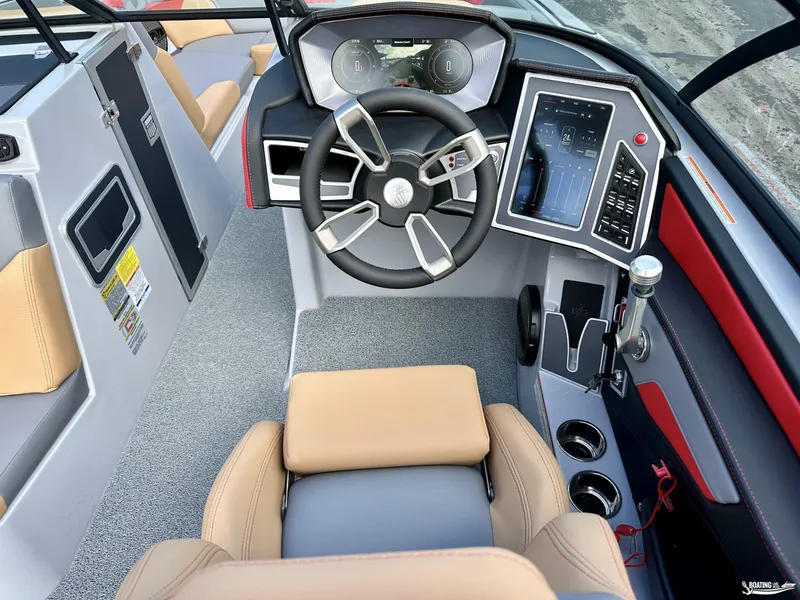 Slide: The Image of 2024 MasterCraft XT24 boat cockpit with modern steering and digital controls. - 11