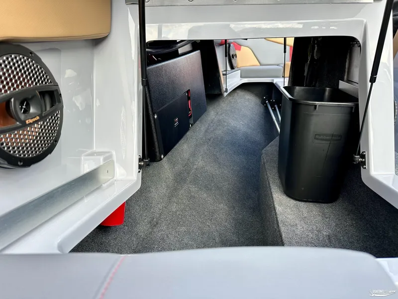Slide: The Image of Interior of 2024 MasterCraft XT24 boat with speaker and storage area. - 14